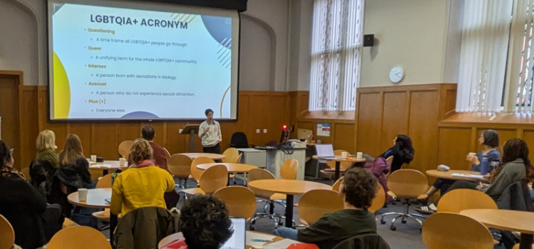 Speaker delivering LGBTQIA+ Awareness Training to audience